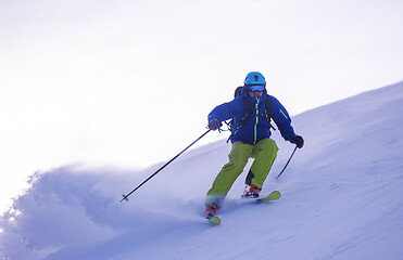 Image showing Skier having fun while running downhill