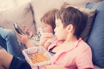 Image showing cute little brother and sister having fun at home