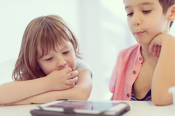 Image showing cute little brother and sister having fun at home