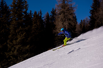 Image showing Skier having fun while running downhill