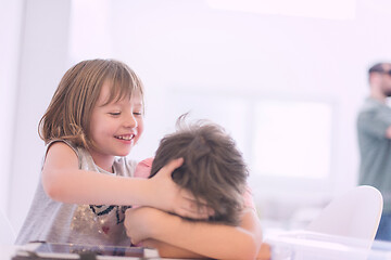 Image showing cute little brother and sister having fun at home