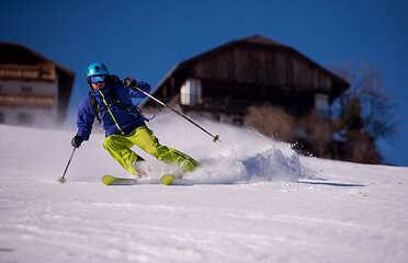 Image showing Skier having fun while running downhill