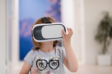 Image showing little girl at home wearing vr glasses