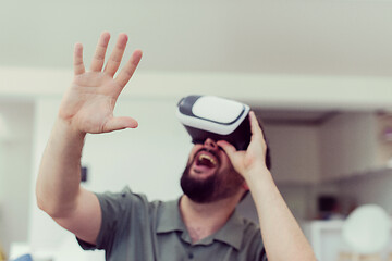 Image showing man with beard trying vr glasses