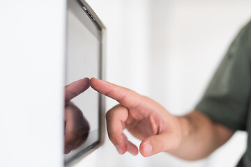 Image showing smart home and technology concept close up of male hands