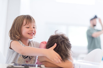 Image showing cute little brother and sister having fun at home