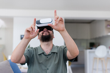 Image showing man with beard trying vr glasses