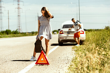 Image showing Young couple traveling on the car in sunny day