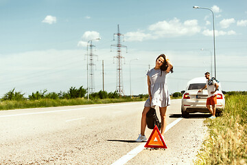 Image showing Young couple traveling on the car in sunny day