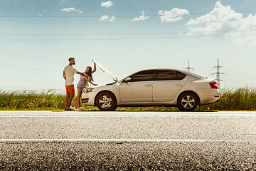 Image showing Young couple traveling on the car in sunny day