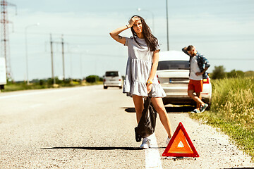 Image showing Young couple traveling on the car in sunny day