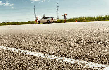 Image showing Young couple traveling on the car in sunny day