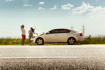 Image showing Young couple traveling on the car in sunny day