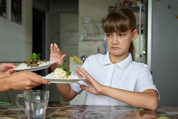 Image showing The girl refuses to eat homemade food for lunch