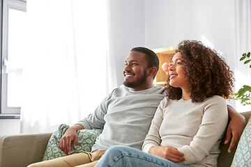 Image showing happy african american couple hugging at home