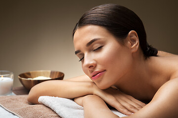 Image showing young woman lying at spa or massage parlor