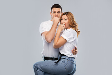 Image showing scared couple in white t-shirts