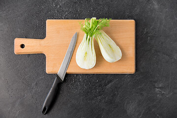 Image showing fennel and kitchen knife on wooden cutting board