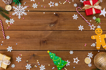 Image showing christmas gifts and decorations on wooden boards