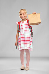 Image showing little student girl with school lunch in paper bag