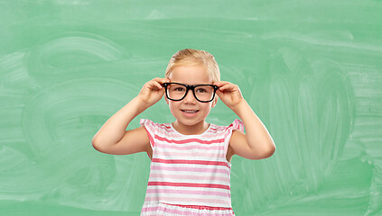 Image showing smiling cute little girl in glasses at school
