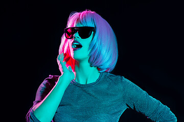 Image showing happy woman in pink wig and black sunglasses