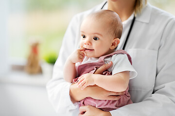 Image showing female pediatrician doctor with baby at clinic