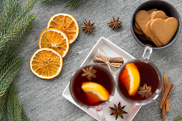 Image showing mulled wine, orange slices, gingerbread and spices