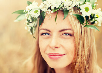 Image showing happy woman in wreath of flowers