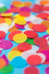 Image showing colorful confetti decoration on blue background