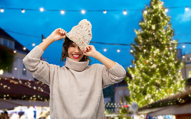 Image showing woman in hat and sweater at christmas market
