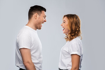 Image showing portrait of laughinh couple in white t-shirts