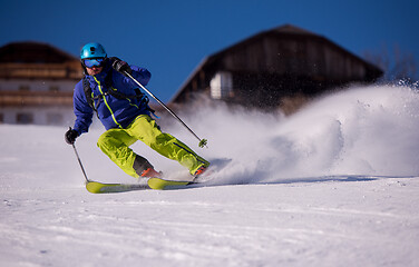 Image showing Skier having fun while running downhill