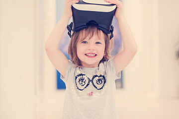 Image showing little girl at home wearing vr glasses