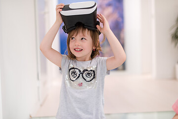 Image showing little girl at home wearing vr glasses