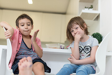 Image showing cute little brother and sister at home