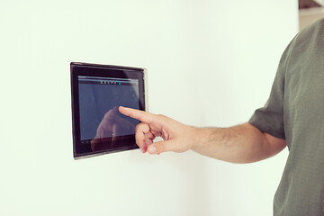 Image showing smart home and technology concept close up of male hands