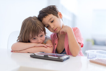 Image showing cute little brother and sister having fun at home