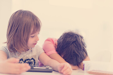 Image showing cute little brother and sister having fun at home