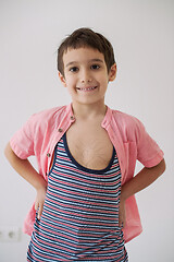 Image showing lilittle boy looking at heart love symbol sketched on his chest