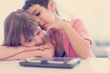 Image showing cute little brother and sister having fun at home