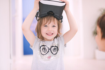 Image showing little girl at home wearing vr glasses