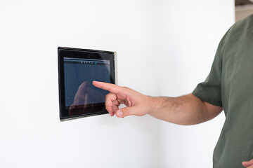 Image showing smart home and technology concept close up of male hands