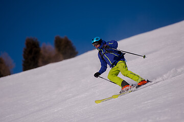 Image showing Skier having fun while running downhill