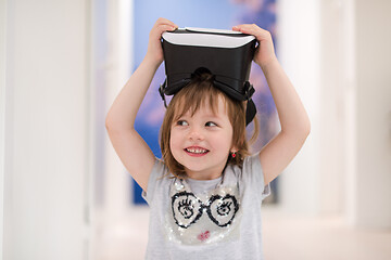 Image showing little girl at home wearing vr glasses