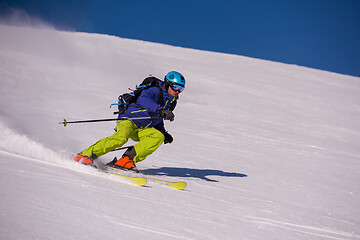 Image showing Skier having fun while running downhill