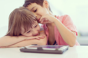 Image showing cute little brother and sister having fun at home