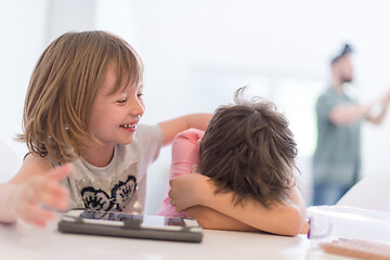 Image showing cute little brother and sister having fun at home