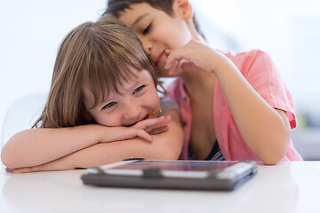 Image showing cute little brother and sister having fun at home