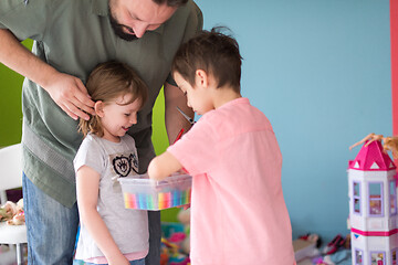 Image showing sister and brother havin fun and play hairstylist game at home